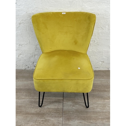 230 - A modern yellow fabric upholstered occasional chair on metal hairpin supports