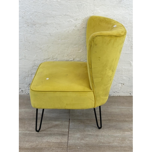 230 - A modern yellow fabric upholstered occasional chair on metal hairpin supports