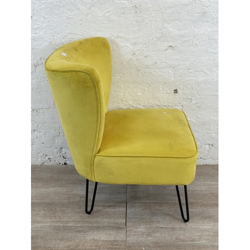 230 - A modern yellow fabric upholstered occasional chair on metal hairpin supports