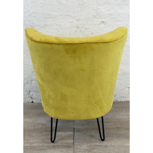 230 - A modern yellow fabric upholstered occasional chair on metal hairpin supports