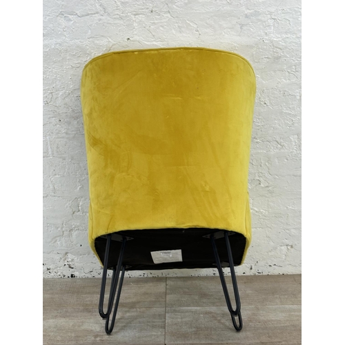 230 - A modern yellow fabric upholstered occasional chair on metal hairpin supports