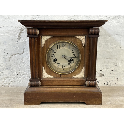 233 - A late 19th/early 20th century mahogany cased chiming mantel clock with pendulum - approx. 28cm high... 