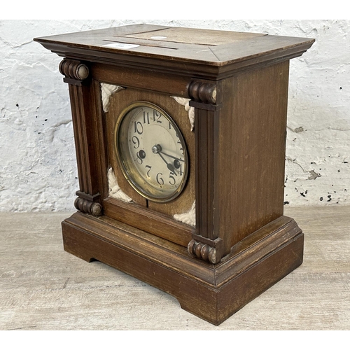 233 - A late 19th/early 20th century mahogany cased chiming mantel clock with pendulum - approx. 28cm high... 