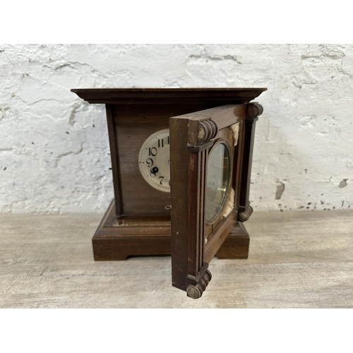 233 - A late 19th/early 20th century mahogany cased chiming mantel clock with pendulum - approx. 28cm high... 