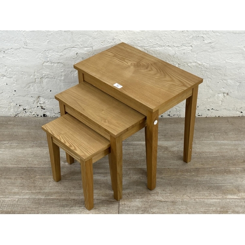 236 - A modern oak nest of three tables - approx. 45cm high x 48cm wide x 30cm deep