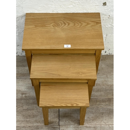 236 - A modern oak nest of three tables - approx. 45cm high x 48cm wide x 30cm deep