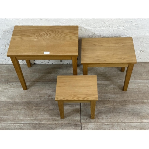 236 - A modern oak nest of three tables - approx. 45cm high x 48cm wide x 30cm deep