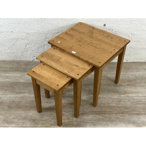 237 - A Next beech nest of three tables - approx. 55cm high x 60cm wide x 50cm deep