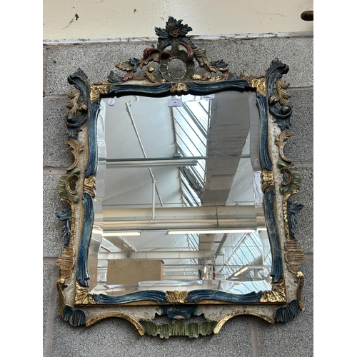 24 - A Rococo style hand painted and gilt carved wood framed bevelled edge wall mirror - approx. 80cm hig... 