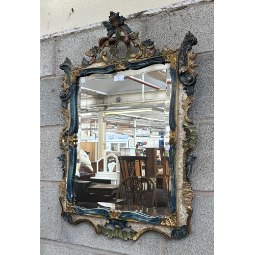 24 - A Rococo style hand painted and gilt carved wood framed bevelled edge wall mirror - approx. 80cm hig... 