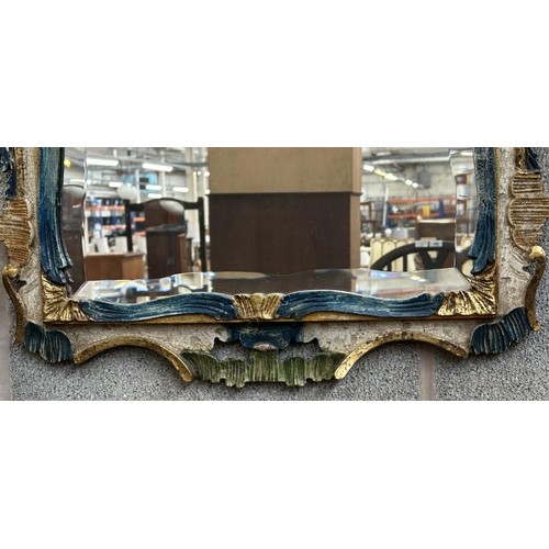 24 - A Rococo style hand painted and gilt carved wood framed bevelled edge wall mirror - approx. 80cm hig... 