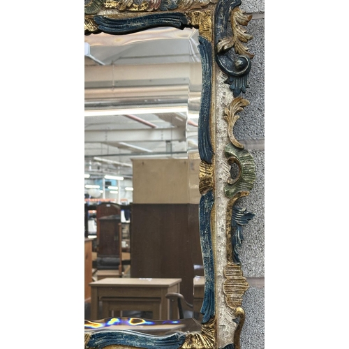 24 - A Rococo style hand painted and gilt carved wood framed bevelled edge wall mirror - approx. 80cm hig... 