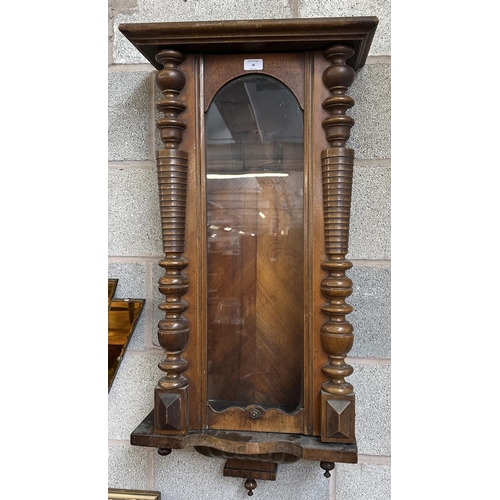 28 - A Victorian walnut Vienna clock case