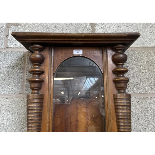 28 - A Victorian walnut Vienna clock case