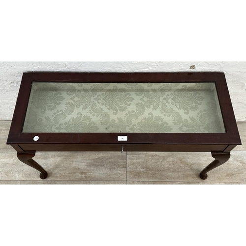 29 - A mahogany bijouterie table - approx. 50cm high x 93cm wide x 36cm deep