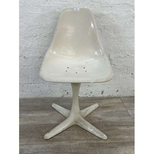 302 - A mid 20th century Maurice Burke for Arkana white moulded plastic swivel Tulip dining chair - approx... 