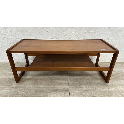 303 - A mid 20th century teak coffee table - approx. 43cm high x 43cm wide x 111cm long