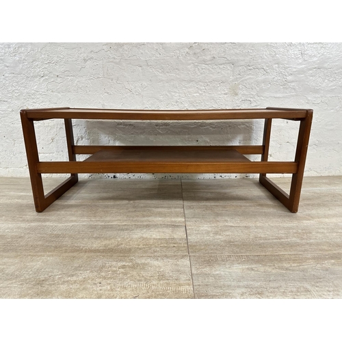 303 - A mid 20th century teak coffee table - approx. 43cm high x 43cm wide x 111cm long