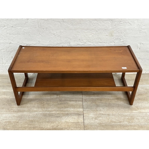303 - A mid 20th century teak coffee table - approx. 43cm high x 43cm wide x 111cm long