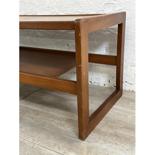 303 - A mid 20th century teak coffee table - approx. 43cm high x 43cm wide x 111cm long