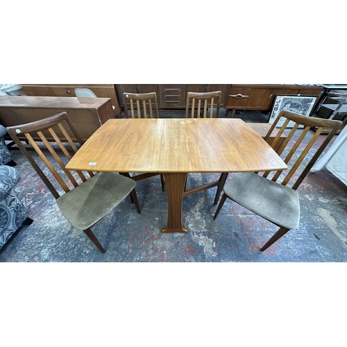 314 - A Legate teak drop leaf gate leg dining table and four G Plan Fresco teak and green fabric dining ch... 