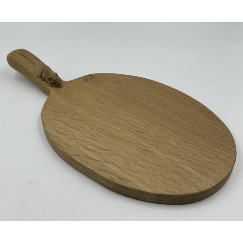 317 - A Robert 'Mouseman' Thompson adzed oak cheeseboard - approx. 39cm long