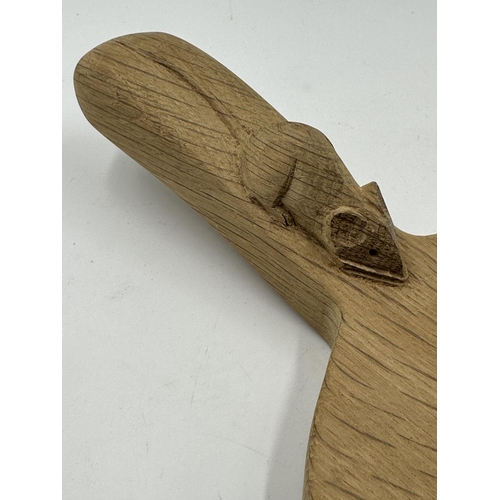 317 - A Robert 'Mouseman' Thompson adzed oak cheeseboard - approx. 39cm long