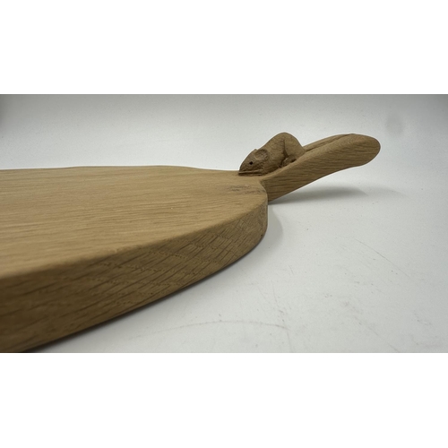 317 - A Robert 'Mouseman' Thompson adzed oak cheeseboard - approx. 39cm long