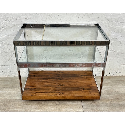 318 - A 1970s Merrow Associates rosewood and chrome plated drinks trolley with glass top, CITES A10 certif... 