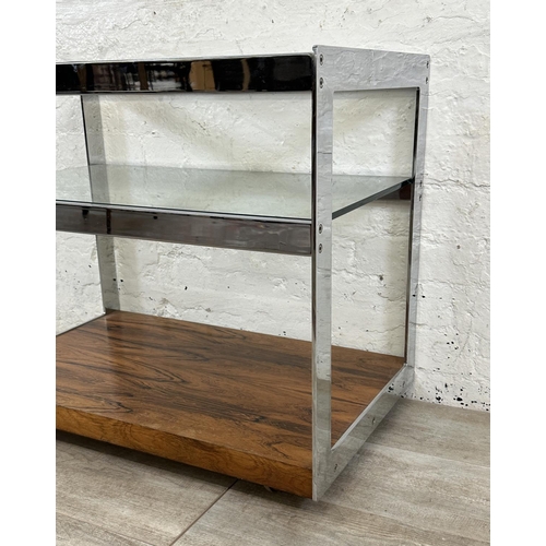 318 - A 1970s Merrow Associates rosewood and chrome plated drinks trolley with glass top, CITES A10 certif... 