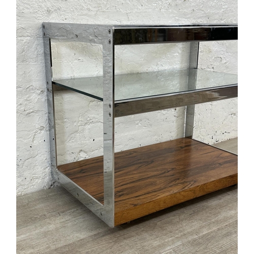 318 - A 1970s Merrow Associates rosewood and chrome plated drinks trolley with glass top, CITES A10 certif... 