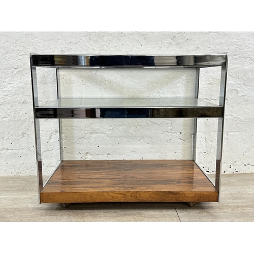 318 - A 1970s Merrow Associates rosewood and chrome plated drinks trolley with glass top, CITES A10 certif... 