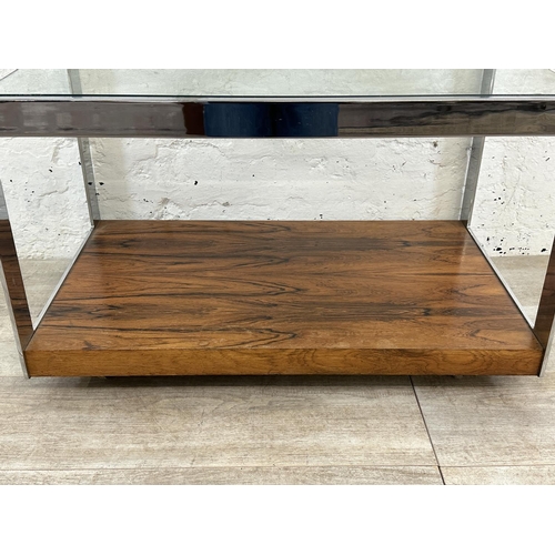 318 - A 1970s Merrow Associates rosewood and chrome plated drinks trolley with glass top, CITES A10 certif... 