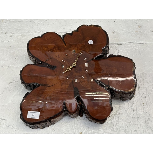 34 - A mid 20th century live edge tree slice quartz wall clock - approx. 40cm diameter