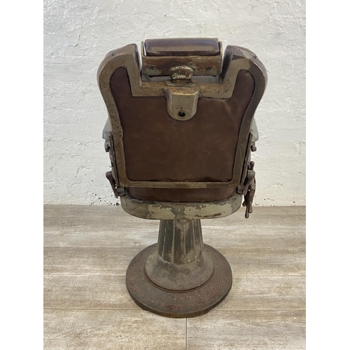 347 - An early 20th century cast iron and brown vinyl upholstered barber's chair - approx. 103cm high x 50... 