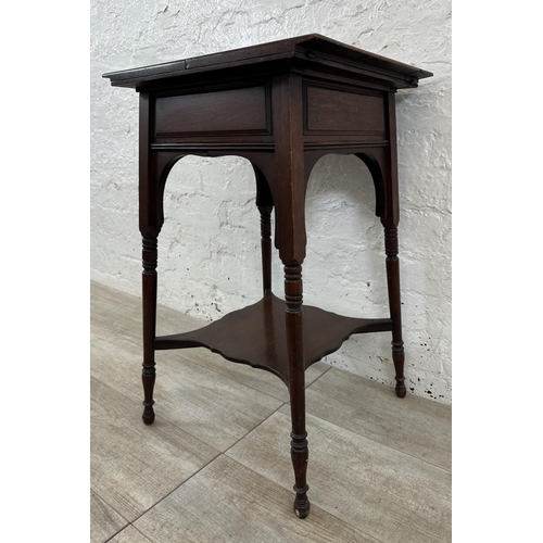 4 - An Edwardian mahogany fold over work table - approx. 66cm high x 76cm wide when extended x 38cm deep