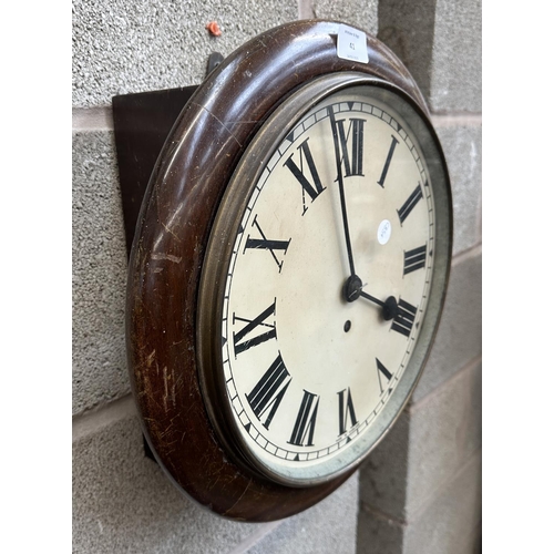 41 - A Victorian mahogany cased key wind circular wall clock - approx. 39cm diameter