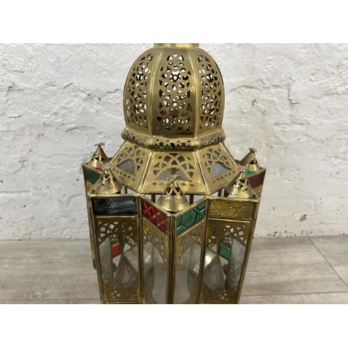 42 - A Moroccan gilt metal and stained glass hanging lantern - approx. 57cm high