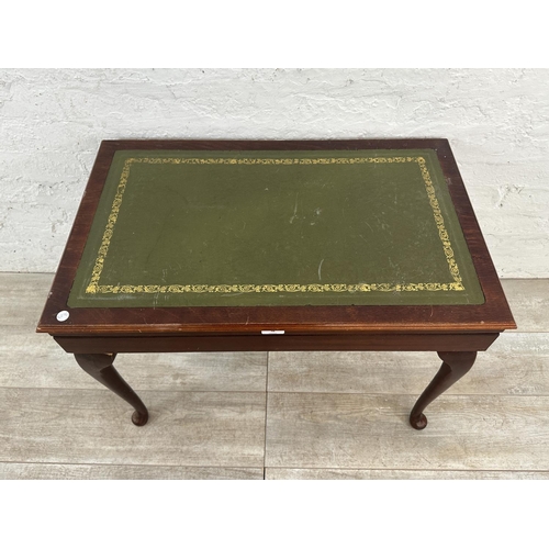 48 - A mid 20th century mahogany and green leather cutlery table containing EPNS King's pattern cutlery -... 