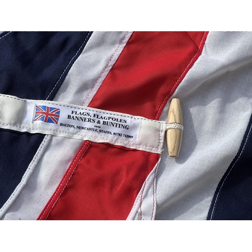 50 - Three items, one length of The Queen's Platinum Jubilee bunting and two Union Jack flags - largest a... 