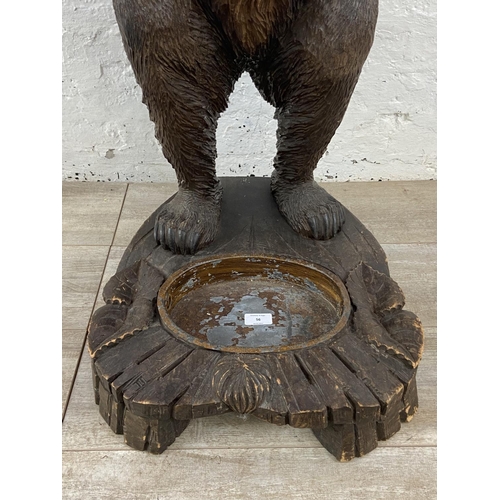 56 - A late 19th/early 20th century Black Forest carved wooden bear free standing umbrella stick stand - ... 