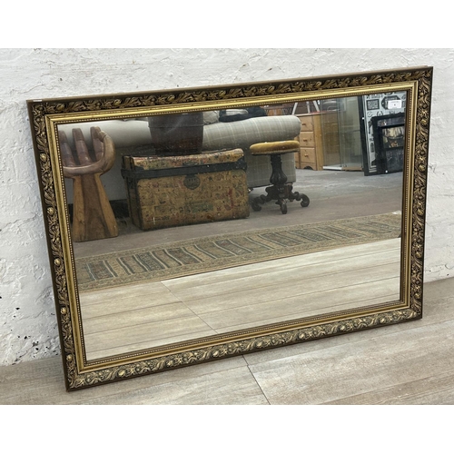 6 - A 19th century style gilt framed wall mirror - approx. 71cm high x 101cm wide