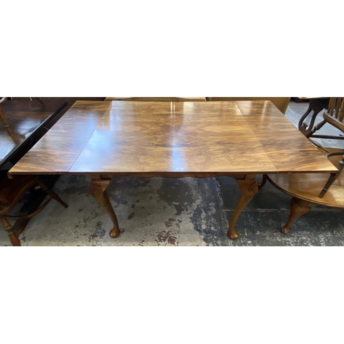 67 - A Queen Anne style walnut draw leaf dining table - approx. 77cm high x 91cm wide x 111cm long