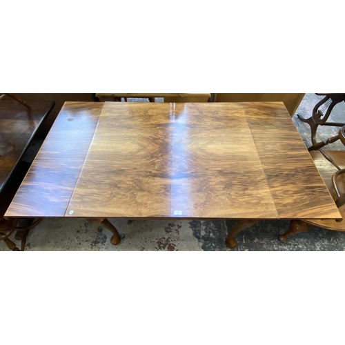 67 - A Queen Anne style walnut draw leaf dining table - approx. 77cm high x 91cm wide x 111cm long