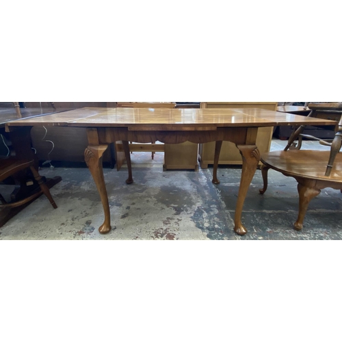 67 - A Queen Anne style walnut draw leaf dining table - approx. 77cm high x 91cm wide x 111cm long