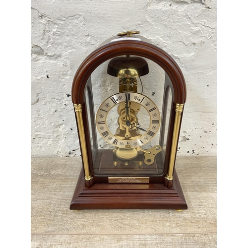 71 - A late 20th century German Hermle mahogany and brass cased key wind presentation mantel clock with k... 
