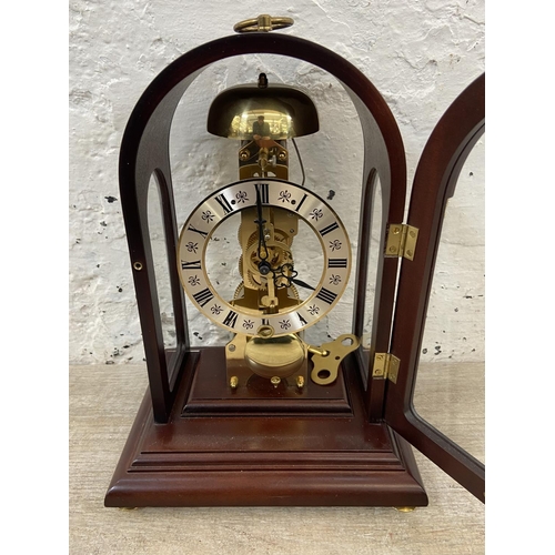 71 - A late 20th century German Hermle mahogany and brass cased key wind presentation mantel clock with k... 