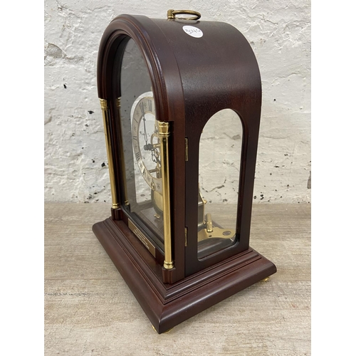 71 - A late 20th century German Hermle mahogany and brass cased key wind presentation mantel clock with k... 