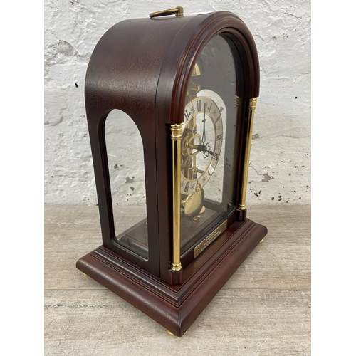 71 - A late 20th century German Hermle mahogany and brass cased key wind presentation mantel clock with k... 