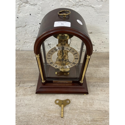 71 - A late 20th century German Hermle mahogany and brass cased key wind presentation mantel clock with k... 